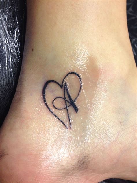 ideas for initial tattoos|heart tattoos with initials inside.